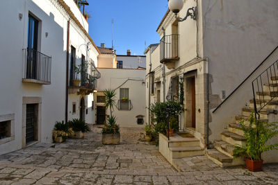 A narrow street between old houses in venosa, town in basilicata region, italy.