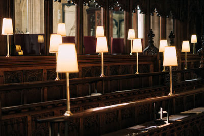 Row of illuminated lamp in building