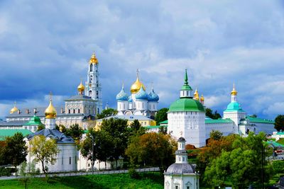 View of buildings against cloudy sky