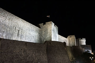 Low angle view of fort against sky at night