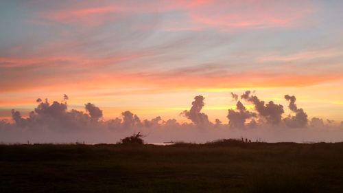 Scenic view of landscape against sky during sunset