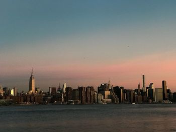 Skyscrapers lit up at sunset