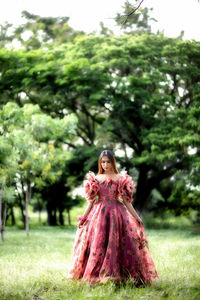 Woman standing on grass