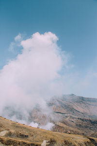 Smoke emitting from volcanic landscape