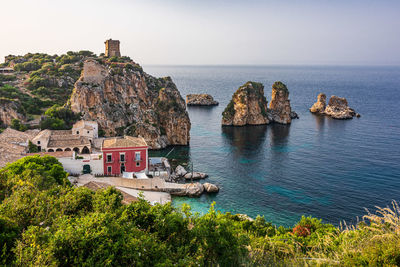 Panoramic view of sea and buildings against sky