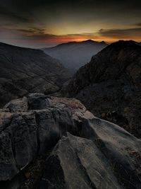 Scenic view of mountains against sky during sunset