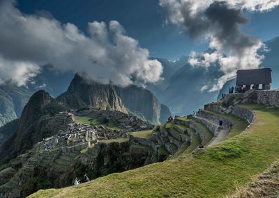 Panoramic view of mountains against cloudy sky