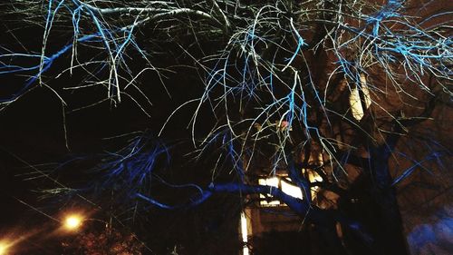 Low angle view of illuminated sky at night