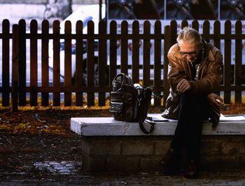 People looking at street by temple
