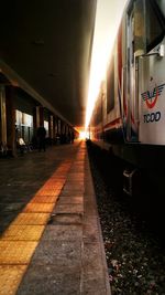 Train at railroad station against sky