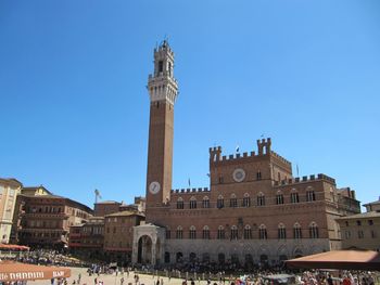 Low angle view of historical building against clear blue sky