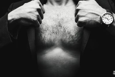 Midsection of man standing at home