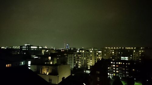 High angle view of illuminated buildings in city at night