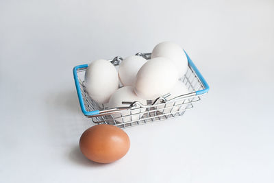 High angle view of eggs against white background