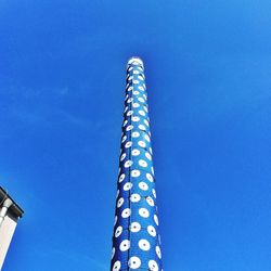 Low angle view of tower against clear blue sky