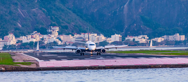 Brazilian commercial plane taxiing on the runway at santos dumont national airport