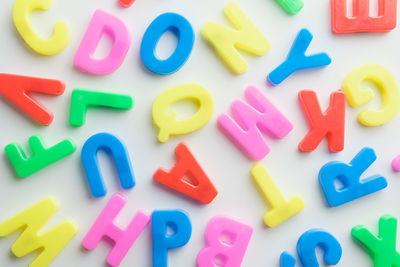 High angle view of multi colored toy on white background
