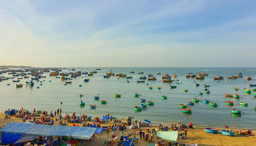 High angle view of people on beach against sky