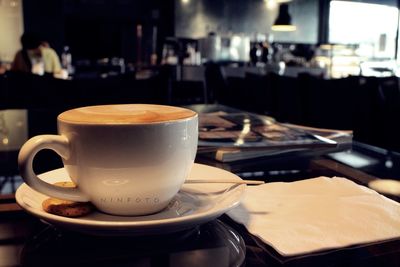 Close-up of coffee served on table in cafe