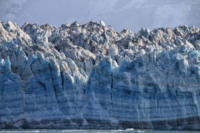 Panoramic view of frozen sea against mountain