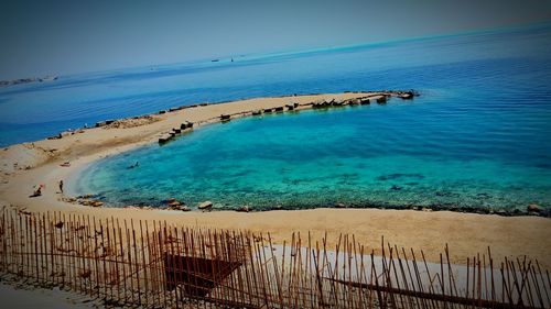 Scenic view of sea against blue sky