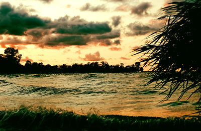 Scenic view of sea against sky at sunset