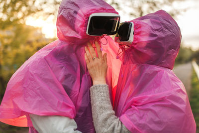 Couple wearing virtual reality simulator on road