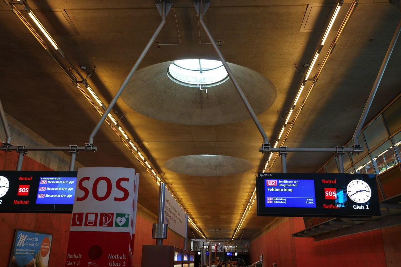 LOW ANGLE VIEW OF ILLUMINATED LIGHT HANGING ON CEILING