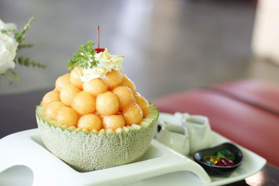 Close-up of fruits in plate on table