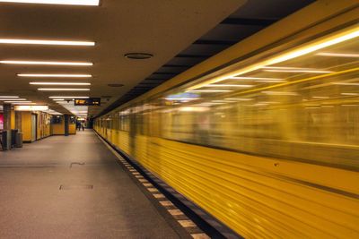 Blurred motion of train at railroad station at night