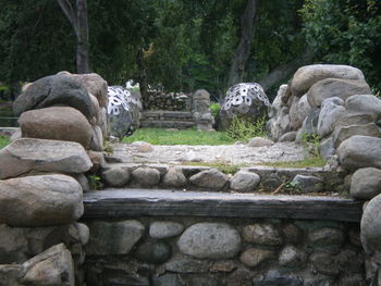 Statue against trees