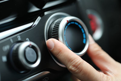 Close-up of hand holding camera