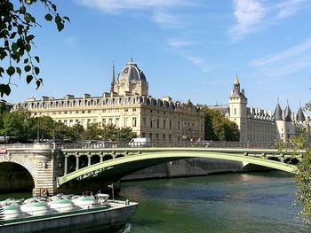 Bridge over river with buildings in background