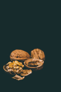 Close-up of pastries against black background