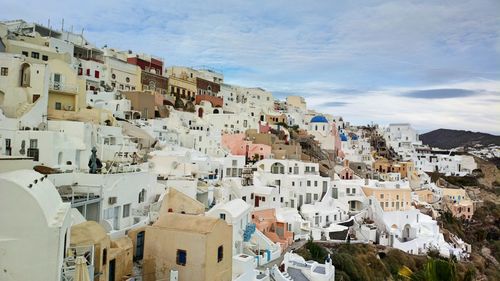 High angle view of buildings in town against sky