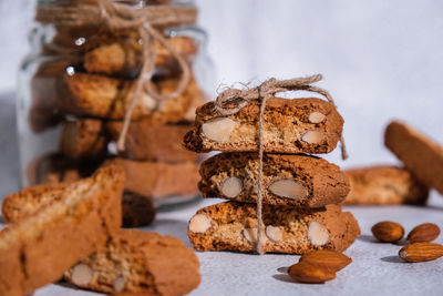 Traditional italian cantuccini cookies with almonds in glass jar. sweet dried biscuits. homemade 