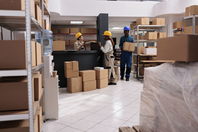 Rear view of woman standing in store