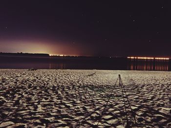 Scenic view of sea against clear sky at night