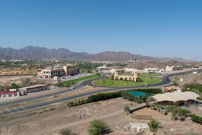 High angle view of road against clear blue sky