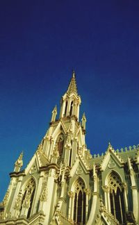 Low angle view of cathedral against blue sky