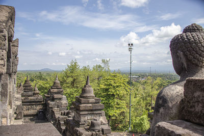 Panoramic view of temple against building