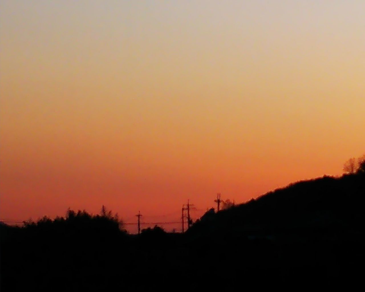 sunset, silhouette, orange color, nature, beauty in nature, tranquil scene, no people, copy space, tranquility, scenics, outdoors, mountain, electricity pylon, sky, landscape, tree, clear sky, day