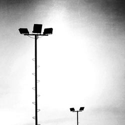 Low angle view of street light against sky