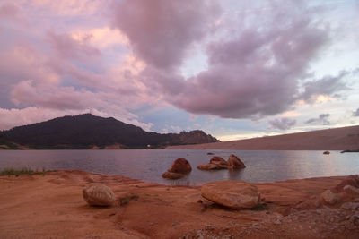 Scenic view of lake against sky during sunset