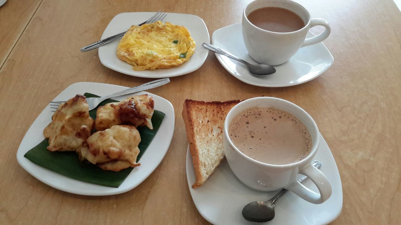 food and drink, indoors, coffee cup, drink, table, freshness, coffee - drink, refreshment, food, plate, still life, saucer, breakfast, coffee, spoon, high angle view, cup, healthy eating, ready-to-eat, directly above