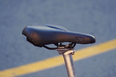 Close-up of bicycle wheel against sky