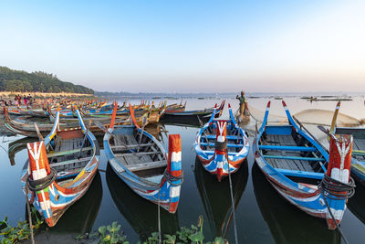 Boats moored at harbor