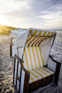 Empty chairs on beach