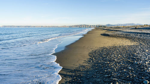 Scenic view of beach against sky