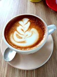 Close-up of cappuccino on table